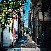 Buy canvas prints of An Urban Side Street in Bali by James Aston