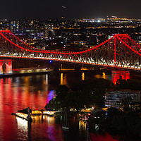 Buy canvas prints of Aerial view of Story Bridge lit after dark by Andrew Michael