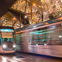 Buy canvas prints of Night view of two trams at Glories station by Andrew Michael