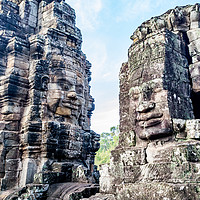 Buy canvas prints of Bayon temple smiling faces by Claire Turner