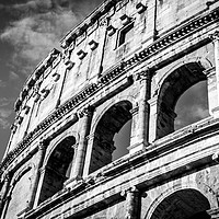 Buy canvas prints of Colosseum arches in black and white by Claire Turner