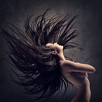 Buy canvas prints of Woman waving long dark hair by Johan Swanepoel
