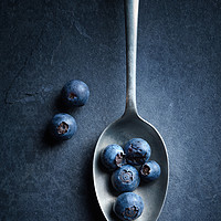 Buy canvas prints of Blueberries on spoon Still Life by Johan Swanepoel