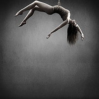 Buy canvas prints of Woman hanging on a rope by Johan Swanepoel