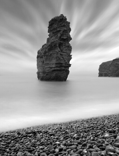Ladram Sea Stack - Black and White Picture Board by David Neighbour
