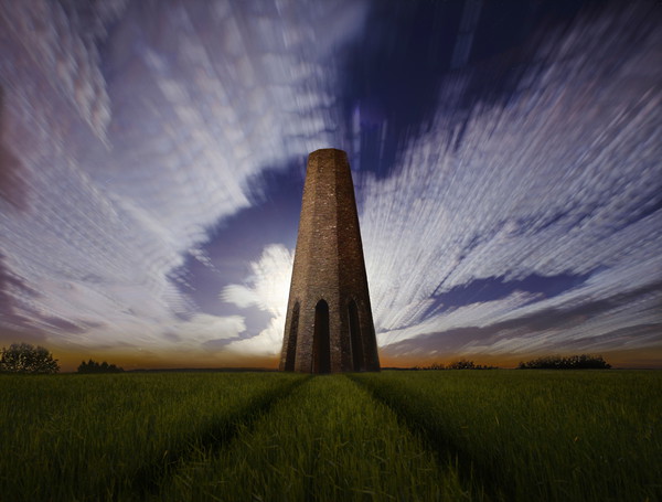 Daymark in a Moonlit Sky Picture Board by David Neighbour