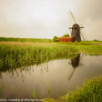 Buy canvas prints of Reflections of an old windmill by Matthew Balls