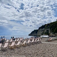Buy canvas prints of A view of deckchairs on Beer beach, Devon by Ailsa Darragh