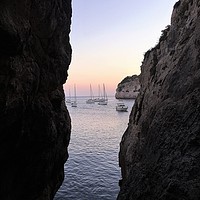 Buy canvas prints of Boats at Sunset, Cala Galdana, Menorca by Ailsa Darragh