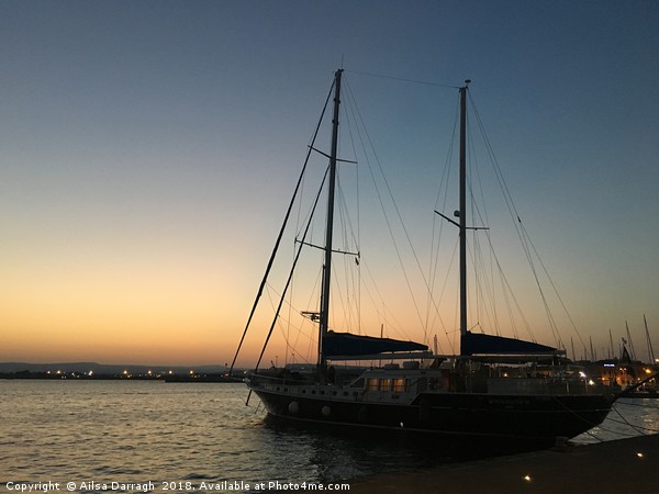 Yacht at sunset, Ortigia, Sicily Picture Board by Ailsa Darragh