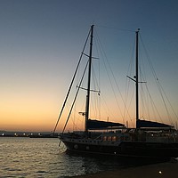 Buy canvas prints of Yacht at sunset, Ortigia, Sicily by Ailsa Darragh