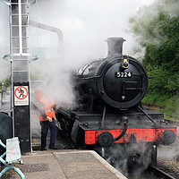 Buy canvas prints of Steam Train taking on water by William A Dobson
