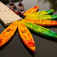 Buy canvas prints of Canoes on the jetty on a French lake by PAUL WILSON