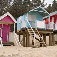 Buy canvas prints of Pretty beach huts by Clive Wells