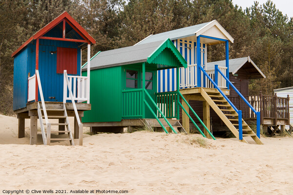 Colourful beach huts Picture Board by Clive Wells