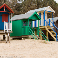 Buy canvas prints of Colourful beach huts by Clive Wells