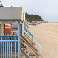 Buy canvas prints of Line of beach huts by Clive Wells