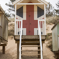Buy canvas prints of Union jack beach hut by Clive Wells