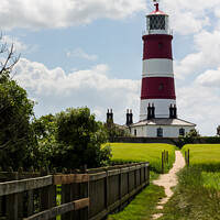 Buy canvas prints of Happisburgh lighthouse at the end of the path by Clive Wells