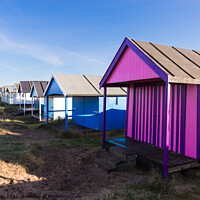 Buy canvas prints of Lovely coloured beach hut  by Clive Wells