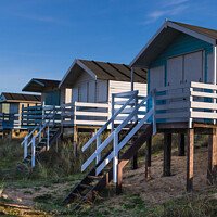 Buy canvas prints of Row of beach huts by Clive Wells