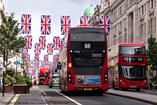 Regent Street with bunting and buses Picture Board by Clive Wells