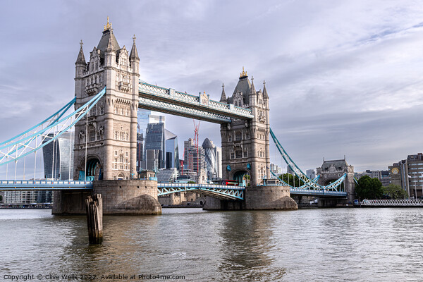 Tower Bridge seen at high tide Picture Board by Clive Wells