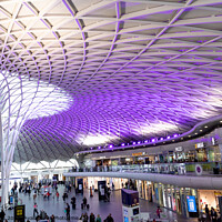 Buy canvas prints of Looking down the concourse at Kings Cross by Clive Wells