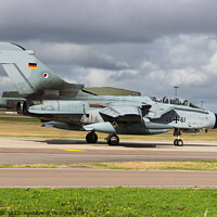 Buy canvas prints of A German Tornado taxi`s to the runway by Clive Wells