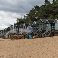Buy canvas prints of Beach huts in an untidy row by Clive Wells