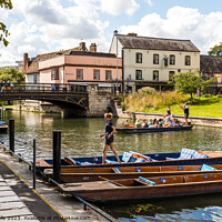 Buy canvas prints of Preparing the punts on the River Cam by Clive Wells