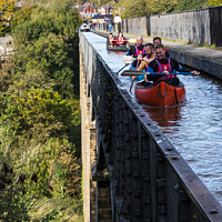 Buy canvas prints of Canoes on the viaduct by Clive Wells