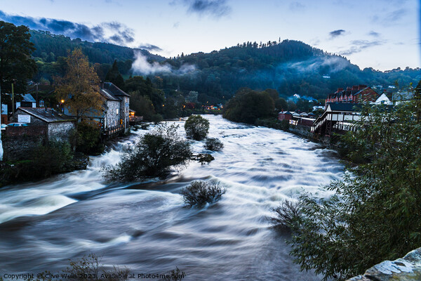 Ghostly mist hangs over the Welsh town of Llangollen Picture Board by Clive Wells