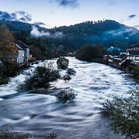 Buy canvas prints of Ghostly mist hangs over the Welsh town of Llangollen by Clive Wells
