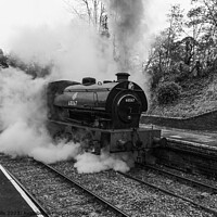 Buy canvas prints of Stean train now leaving Llangollen Station in monochrome by Clive Wells