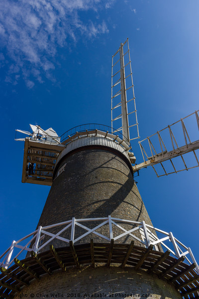 Bircham Windmill under blue Norfolk skies Picture Board by Clive Wells