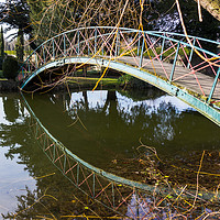 Buy canvas prints of Footbridge with reflection. by Clive Wells