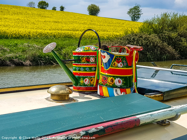 Watering cans on a narrow boat. Picture Board by Clive Wells