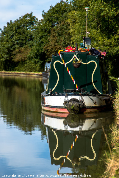 Moored boat on the Grand Union Canal at Blisworth Picture Board by Clive Wells