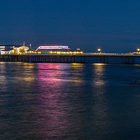 Buy canvas prints of Cromer Pier at night in North Norfolk by Clive Wells