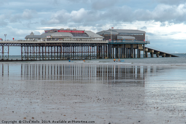 Reflections of Cromer Pier in Norfolk Picture Board by Clive Wells