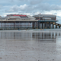 Buy canvas prints of Reflections of Cromer Pier in Norfolk by Clive Wells
