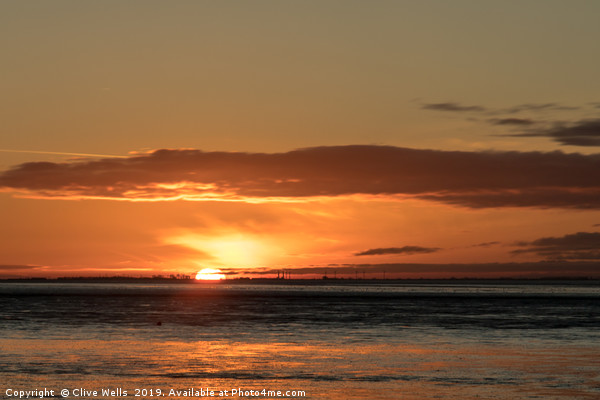 Sunset at Snettisham in Norfolk Picture Board by Clive Wells