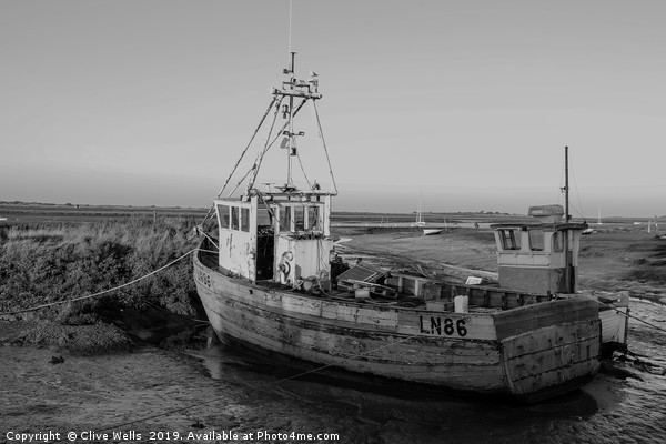 Monochrone fishing boat at Brancaster Staith Picture Board by Clive Wells