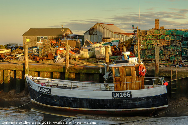 Fishing boat at Brancaster Staith in Norfolk Picture Board by Clive Wells