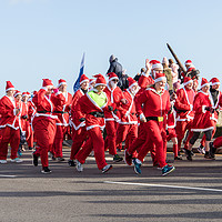 Buy canvas prints of Santa Fun Run at Folkstone in Kent by Clive Wells