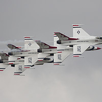 Buy canvas prints of Thunderbirds in a four ship in formation at RIAT by Clive Wells