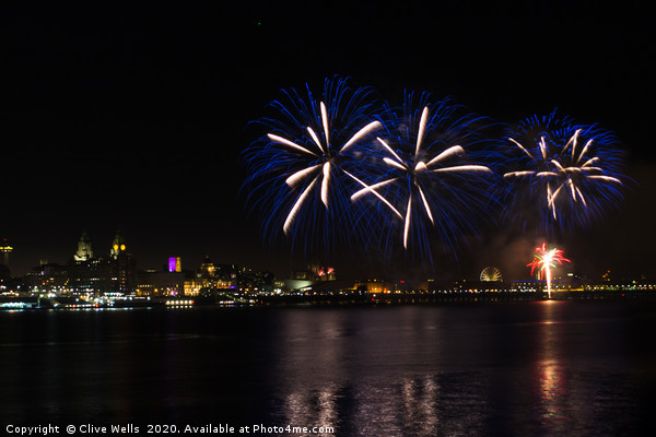 Fireworks high above Liverpool waterfront Picture Board by Clive Wells