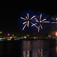 Buy canvas prints of Fireworks high above Liverpool waterfront by Clive Wells