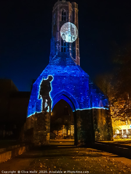 Walking soldier with the moon seen at Kings Lynn  Picture Board by Clive Wells